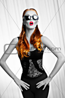 girl with sunglasses in fashion pose .BW shot