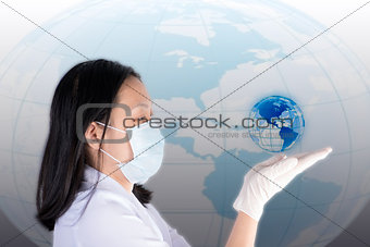 Technician hold and look glowing earth on hand