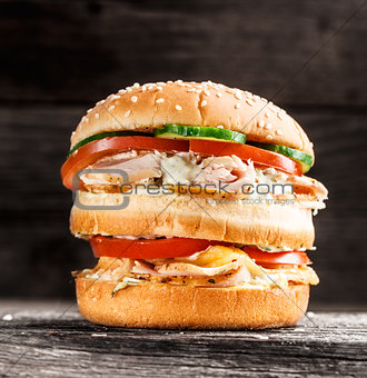 Double burger with chicken and vegetables