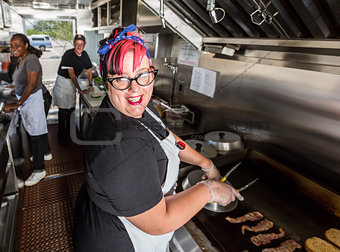 Chef Grills Bacon On a Food Truck