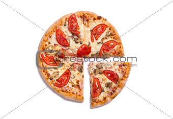 Top view of tasty Italian pizza with ham and tomatoes with a sli