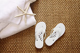 Spa sandals on seagrass mat