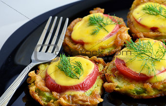 appetizer of  zucchini tomato and cheese