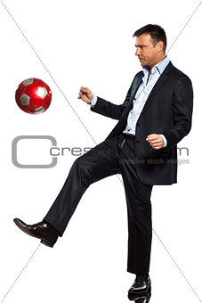 one business man playing juggling soccer ball