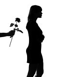 man hand offering a flower rose  silhouette