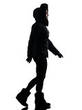 woman winter coat walking silhouette