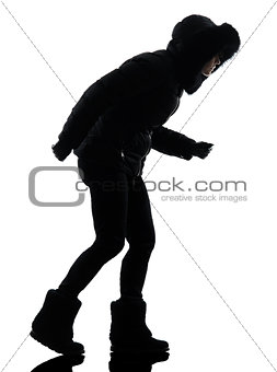 woman winter coat walking windy silhouette