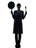 woman smiling cooking holding pan silhouette
