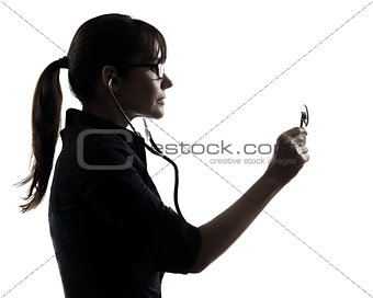 woman doctor holding stethoscope silhouette