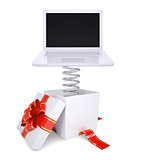 Gift box with red band and laptop