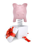 Gift box with red band and piggy bank