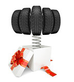 Gift box with red band and car tires