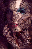 portrait of beauty young woman through lace