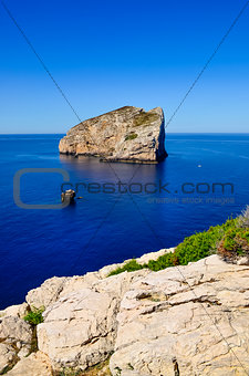 Peaceful landscape view of ocean coast and rocky island, Sardinia