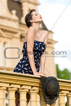 pretty woman with hat in act of enjoy the freedom