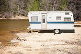 Classic Old Camper Trailer Near A River