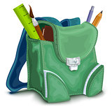 Green backpack with school supplies
