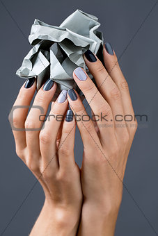 Stylish manicure in shades of gray female elegant handles.