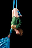 Young woman training on aerial silk