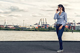 Woman wearing skinny jeans while talking on phone