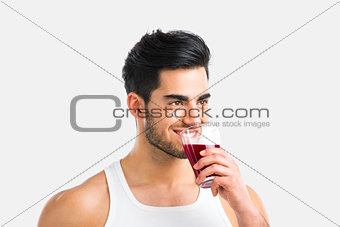 Athletic man drinking a juice