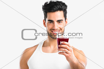 Athletic man drinking a juice