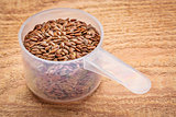 scoop of brown flax seeds 