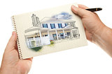 Hands Holding Pen and Pad of Paper with House Drawing