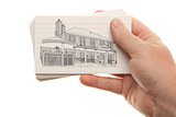 Male Hand Holding Stack of Flash Cards with House Drawing
