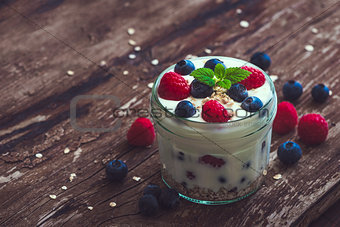Yogurt with Fresh Berries on Woden Table