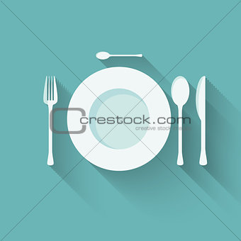 flat plate and cutlery with long shadows