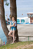 girl near jetty on lake 