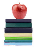 Red apple on pile of books