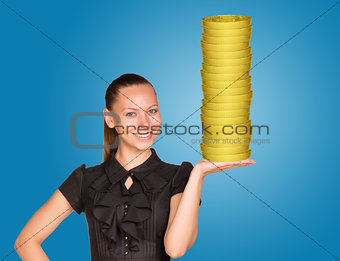 Woman holding coins stack 
