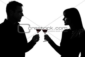one couple man and woman drinking red wine toasting silhouette