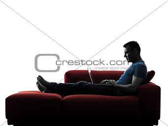 man sofa coach computer computing laptop