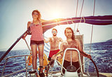 Happy friends on sailboat