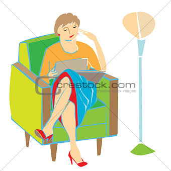 woman reading on armchair