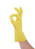 Hand gesturing with yellow cleaning product glove