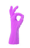 Hand gesturing with purple cleaning product glove