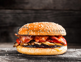 Burger with bacon and vegetables