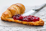 Croissant with lingonberry jam.