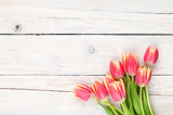 Colorful tulips on wooden table