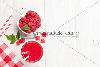 Raspberry smoothie and berries in bowl
