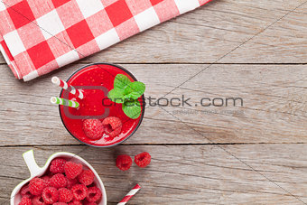 Raspberry smoothie and berries in bowl