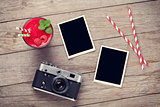 Camera, photo frames and raspberry smoothie
