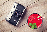 Vintage camera and raspberry smoothie