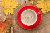 Autumn leaves and coffee cup