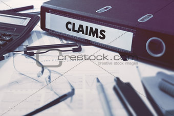 Claims on Ring Binder. Blured, Toned Image.