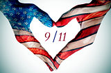 hands forming a heart patterned as the flag of the United States